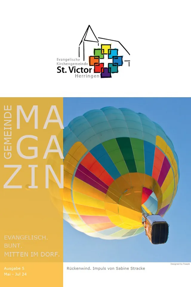 Magazintitelbild mit buntem Heißluftballon und Text.
